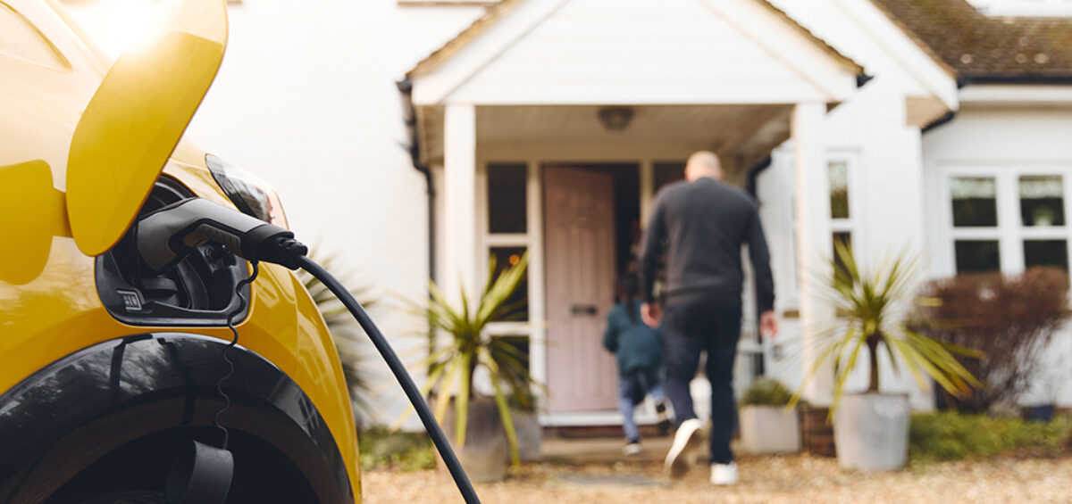 An electric vehicle charging at owner's home