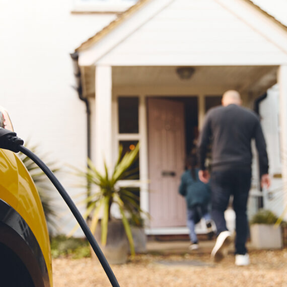 An electric vehicle charging at owner's home