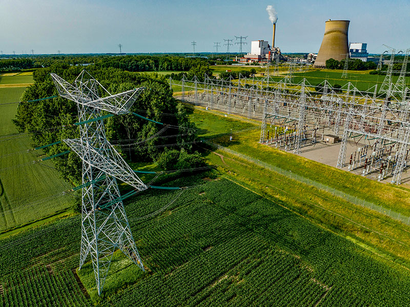 Aerial view of power lines leading to an industrial plant