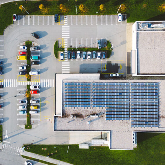 Solar panels on a commercial building where Solar Energy Monitoring vs Inverter Monitoring is a consideration